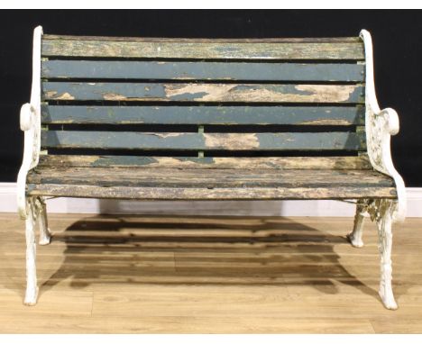 A Victorian cast iron garden bench, cast with lion masks and scrolling leaves, 79cm high, 119cm wide, 70cm deep 