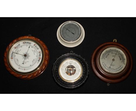 A Victorian oak circular aneroid barometer, 20cm register inscribed Mappin &amp; Webb, Poultry, London, carved rope-twist bor