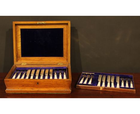 A Victorian walnut canteen box, enclosing silver and mother of pearl flatware comprising twelve fish knives and eleven fish f