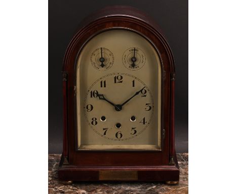 An early 20th century mahogany musical mantel clock, 16cm arched silvered dial inscribed with Arabic numerals, Slow/Fast and 