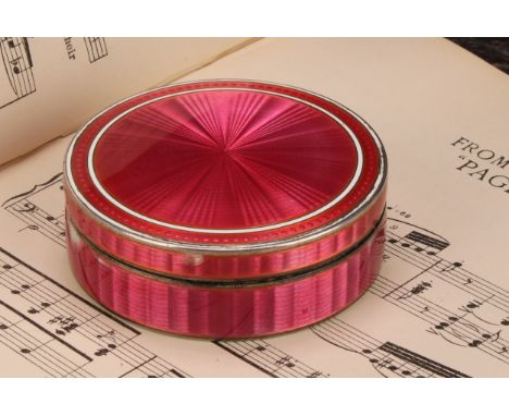 An early 20th century Continental silver and pink guilloche enamel circular table snuff box, push-fitting cover, 9cm diam, im