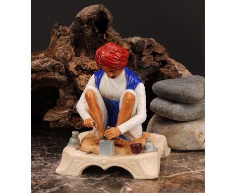 A Royal Worcester figure, Karen Singh - Toolmaker, modelled by James Hadley, 11.5cm high, crown and circle mark in puce, date