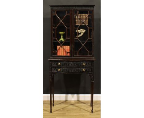 A Chippendale Revival mahogany and blind fretwork library bookcase, moulded cornice above a pair of astragal glazed doors enc