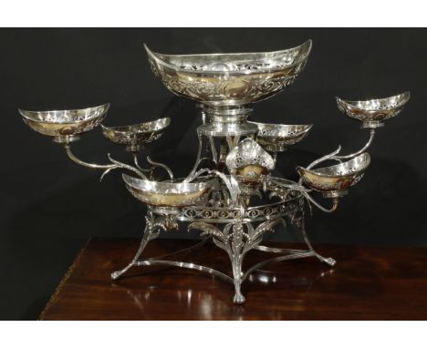 A George III silver table centrepiece epergne, central boat shaped dish above eight scroll branches with further smaller conf