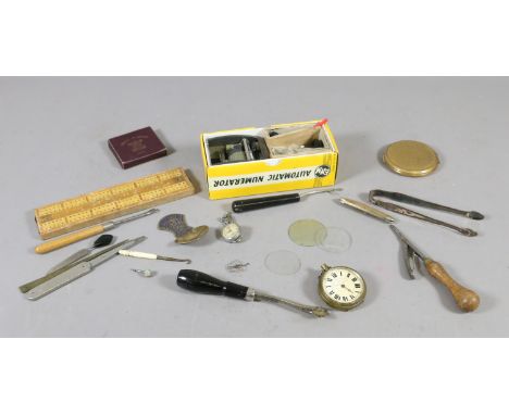A box of miscellaneous collectors items to include Stratton compact, pocket watch, pen knives, sugar tongues and automatic nu