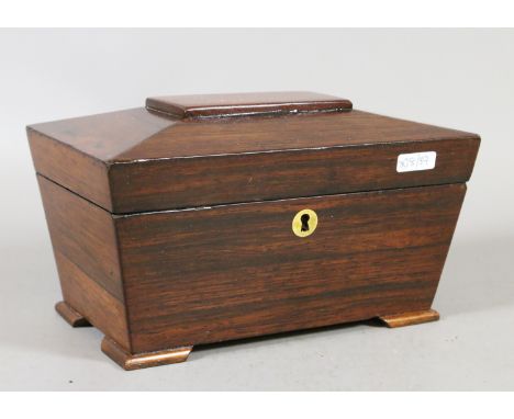 A Regency rosewood tea caddy of sarcophagus form.