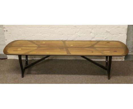 An Ercol style coffee table inlaid with specimen woods. Condition Report. To be used as a guide only. Piece of veneer lacking