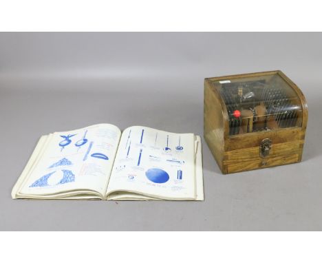 A watch makers/repairers staking tool and punches in wooden dome top box by Meikosha MFG Co. Ltd along with a A. G. Thomas 19