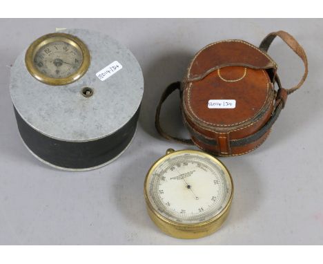 A leather cased improved altitude scale, surveying aneroid compensated along with a metal cased Llewellins Machine Company Li