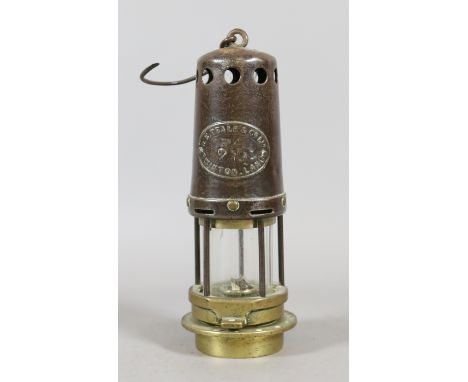An old miners safety lamp W E Teale & Co.