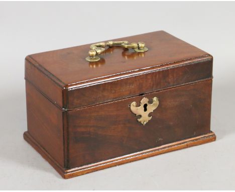 A George III mahogany tea caddy with brass handle and escutcheon having three compartments and raised on a moulded plinth.