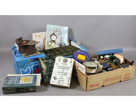 Two boxes of watch and clock repairers tools to include spare parts, watch heads, various manuals and books.