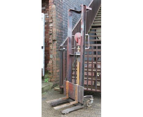 A hand operated hydraulic fork lift barrow truck by Hunter of London.