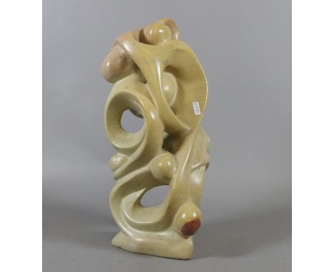 A carved marble abstract figure group.