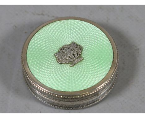 An antique silvered and enamel decorated ladies compact.