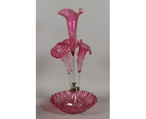 A Victorian four flute cranberry glass epergne, central flute with a chip.