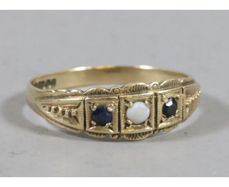 A 9ct gold sapphire and opal ring with a gypsy setting size Q.