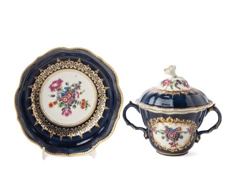 ‡ A WORCESTER CHOCOLATE CUP, COVER AND STAND, CIRCA 1770, painted with panels of flowers inside gilt foliate frames against a