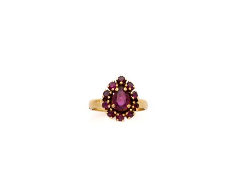RUBY RING, the pear shaped ruby within a row of circular stones, size L 