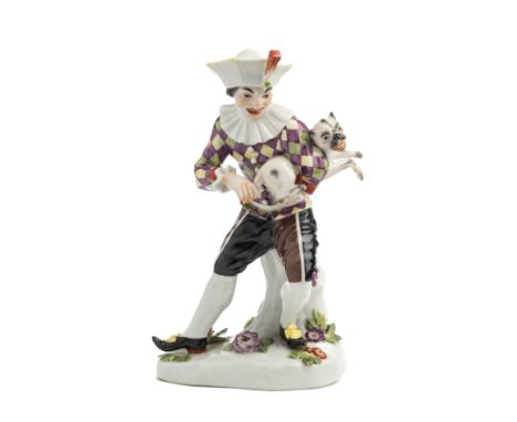 A MEISSEN FIGURE OF HARLEQUIN PLAYING A PUG, 20TH CENTURY, after the model by Johann Joachim Kändler (1706-1775), leaning aga