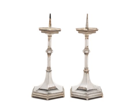 A PAIR OF GEORGE V ARTS AND CRAFTS SILVER PRICKET CANDLESTICKS, ALBERT JOHN WILKINS, LONDON, 1934, hexagonal, with corded bor