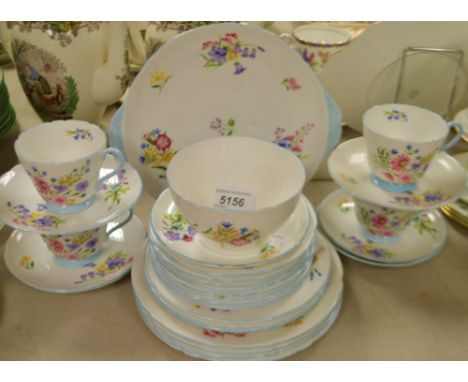 A Shelley Wild Flowers tea service, comprising four teacups, six saucers, eight side plates, three dessert plates, four large