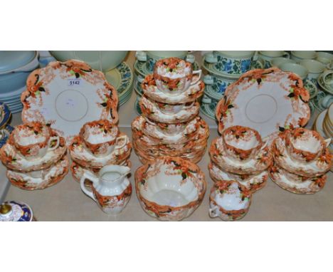 An Edwardian Melba Imari palette tea set, angular bamboo handles, comprising twelve teacups, eleven saucers, twelve tea plate