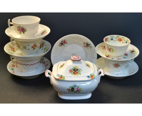 A composed early 19th century cups and saucers painted with floral buds and sprigs; a similar sucrier, c.1820