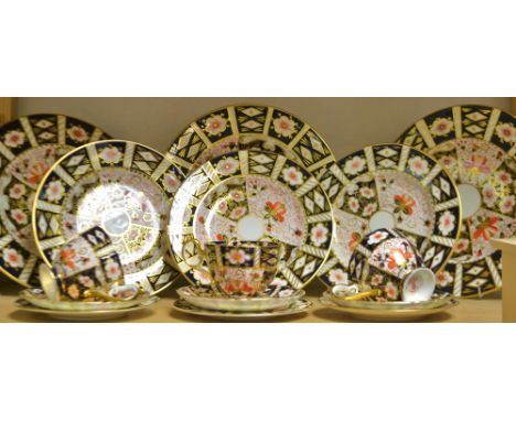 A Royal Crown Derby 2451 part tea and dinner service, including three dinner plates, three desert plates, cups, saucers and s