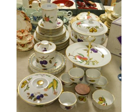 A Royal Worcester Evesham pattern table service including oven dishes, flan dishes, bowls, plates, cake stand, etc. 