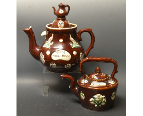 A modern reproduction Measham style Bargeware teapot, miniature teapot finial; a similar kettle (2)