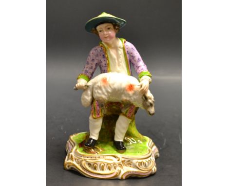 A 19th century Minton figure, of a shepherd boy shearing a sheep, wearing a circular green sun hat and lavender jacket with g