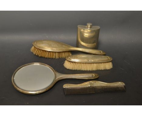 Silver - an Edwardian four piece dressing table comprising hand mirror, clothes brush, hair brush and comb  Birmingham 1920/2