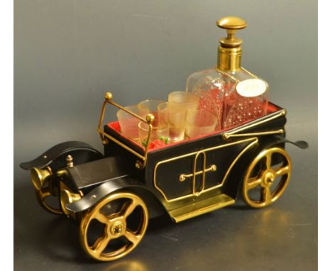 A Kitsch novelty musical whisky decanter, as an open topped vintage motor car (two original tot glasses)