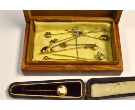 Jewellery - an amethyst and yellow metal ribbon bow stick pin;  others cameo portrait, silver seahorse, anchor, horse shoe et