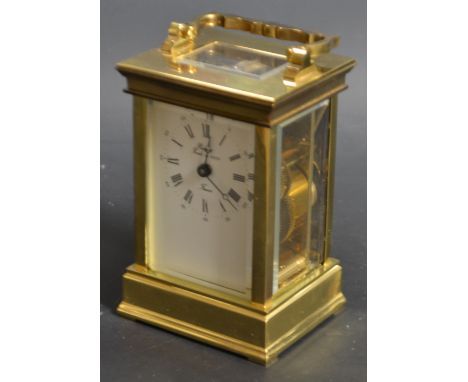 A French brass carriage clock Rapport Fondee en 1900