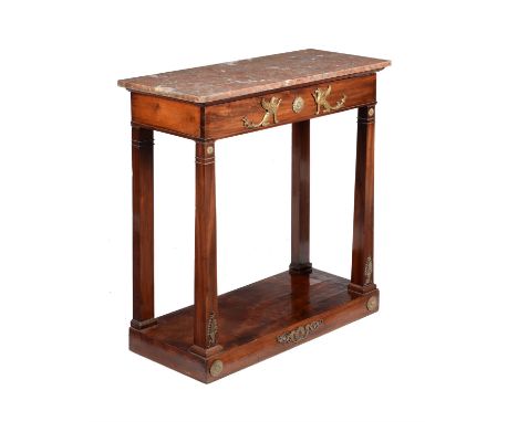 An Empire mahogany and gilt metal mounted console table, circa 1810, the rouge marble top above a blind frieze drawer above f