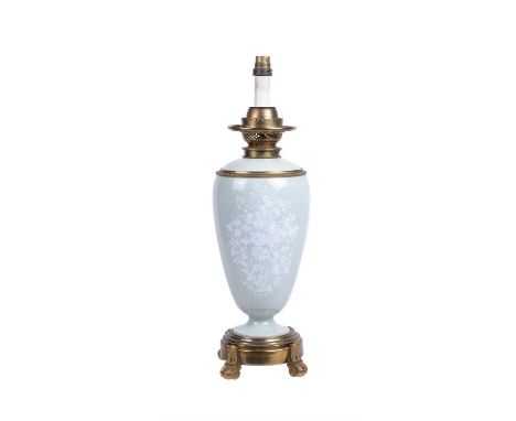 A French pâte-sur-pâte celadon-ground gilt-metal-mounted paraffin lamp base, late 19th century, decorated with flowers and ad