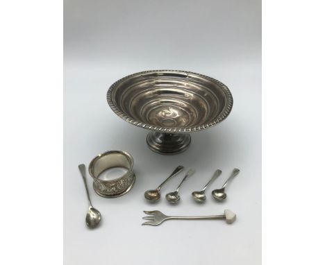 A Sterling silver tazza dish, four  Silver hall marked condiment spoons, a Sheffield silver pickle fork &amp; an EP napkin ri