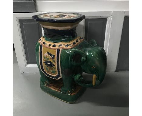 A Large Ceramic elephant stool/ planter stand. Measures 61x64x27cm 