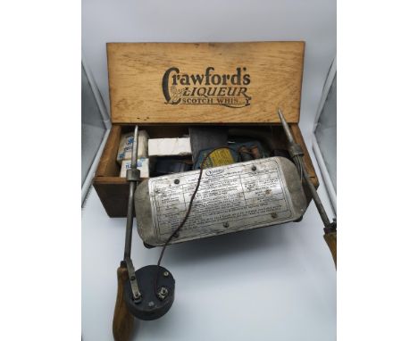 A Crawford's liqueur scotch whisky wooden case with contents to include an Oldham heavy duty discharge tester, a fuse wire ho