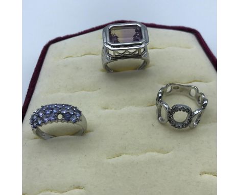 Two silver 925 ladies rings together with 9ct White gold and purple stones ring (one stone missing) 