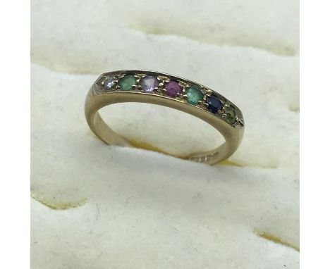 A 9ct gold ladies 7 gem stone ring, set with diamond, sapphire and emerald stones, size N. 