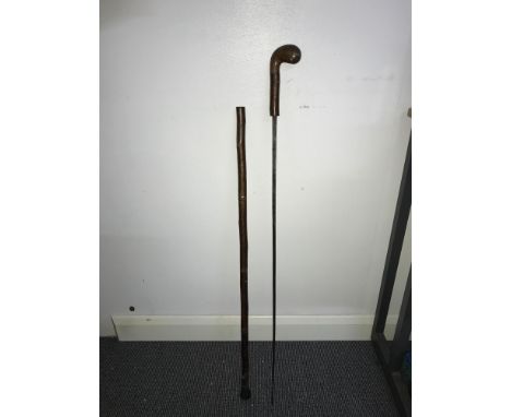 Antique walking stick with hidden sword. Blade measures 74cm in length. Walking stick measures 90cm in length. 