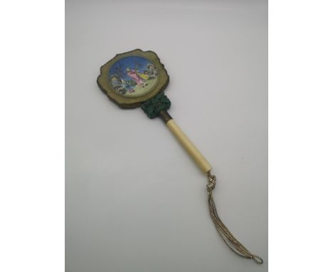 A 19th century highly detailed oriental hand held mirror designed with an ivory turned handle, carved jade section &amp; an e