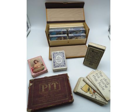 A lot of various playing cards to include; a vintage playing card case fitted with decks of cards and gaming paper, 'PIT' car