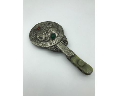 A Chinese white metal, jade and hard stone hand mirror. Measures 23cm in length 