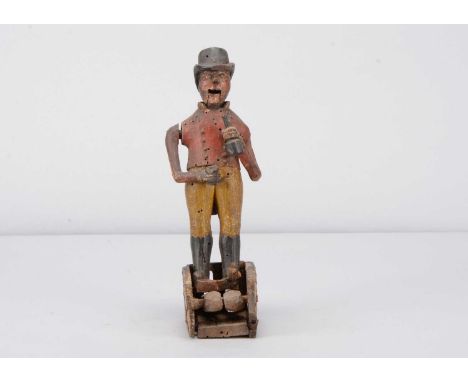 An 18th or early 19th century folk art carved wooden huntsman drinking figure on straw work base,  the man with top hat, arti