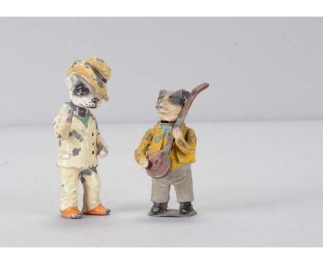 Two late 19th or early 20th century Heyde-type lead dog nodders,  anthropomorphic painted dog in white suite with yellow hat 