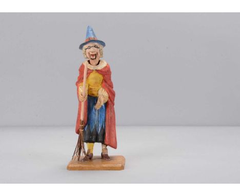 A late 19th century Thüringen Old Mother Hubbard nodder, papier-mâché old women with grey hair, pointed nose, articulated jaw